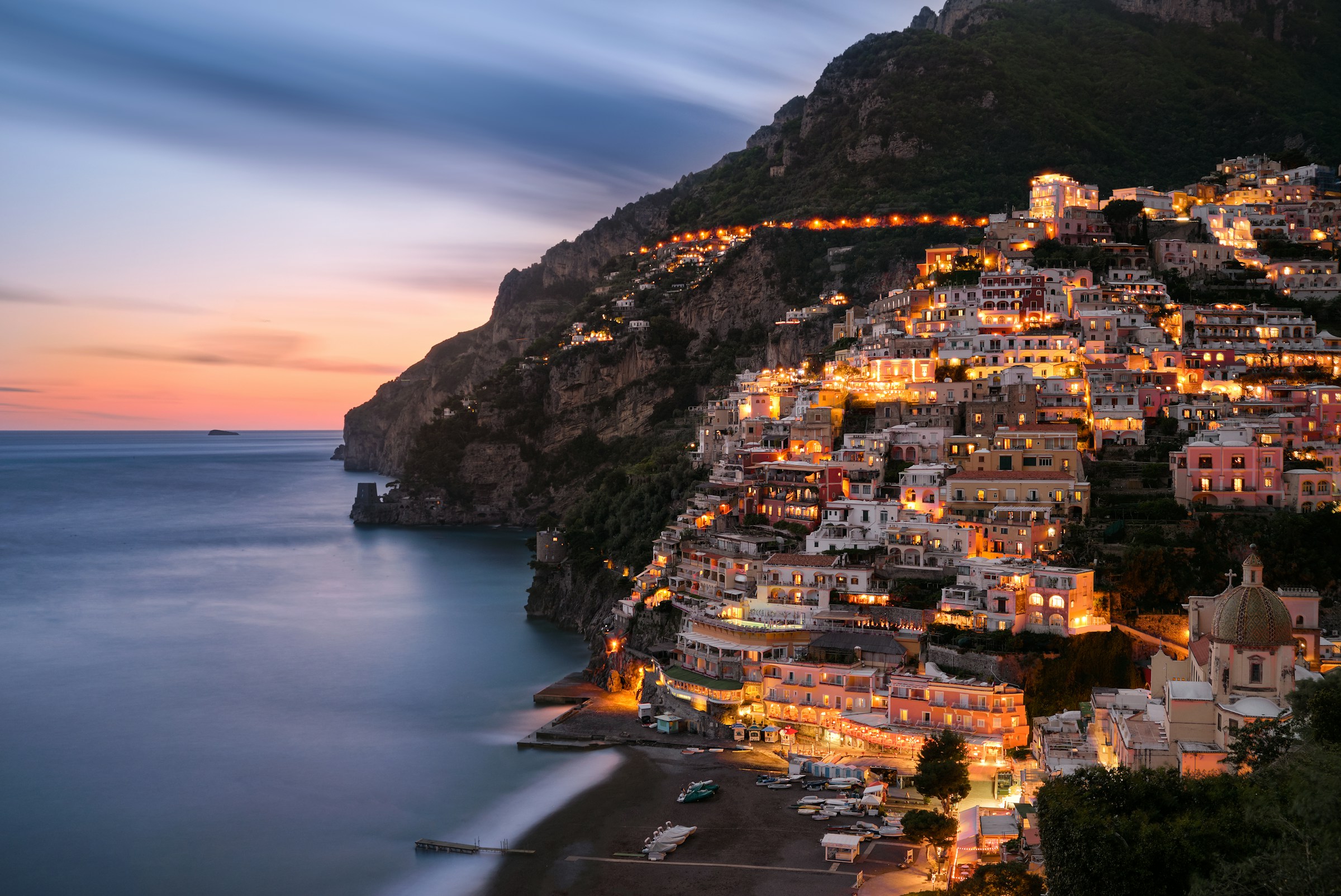 Positano illuminated at blue hour on the Amalfi Coast, Italy